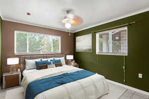 Tiled bedroom featuring crown molding and a ceiling fan