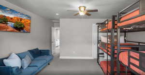 Bedroom with ceiling fan and baseboards