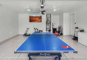 Game room featuring speckled floor