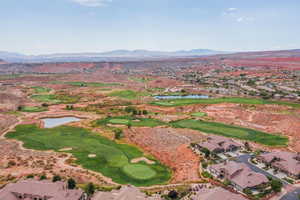 Birds eye view of property with a residential view, golf course view, and a water and mountain view