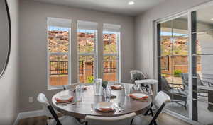 Dining space featuring baseboards and wood finished floors