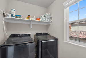 Laundry area with laundry area and washer and clothes dryer