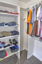 Walk in closet featuring carpet flooring