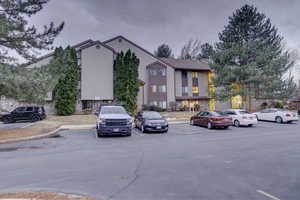 Exterior space featuring uncovered parking