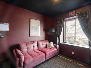 Living area with a textured ceiling and wood finished floors