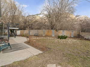 View of yard featuring fence private yard, a patio, and stairway