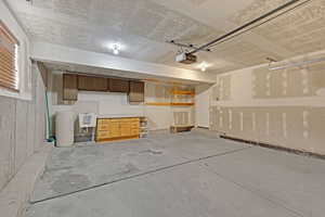 Garage featuring a sink and a garage door opener