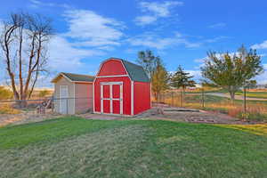 View of shed with fence