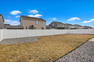 View of yard with a residential view and a fenced backyard