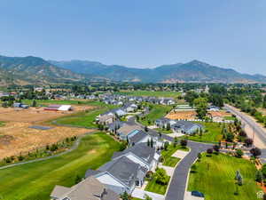 Drone / aerial view with a residential view and a mountain view