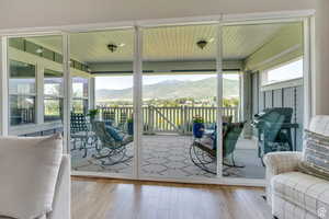 Sunroom with a mountain view