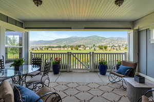 Exterior space featuring a sunroom and a mountain view