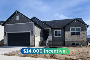 Craftsman-style home with stone siding, board and batten siding, concrete driveway, and a garage