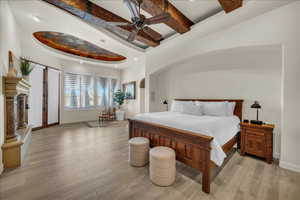 Bedroom with baseboards, a ceiling fan, light wood-style floors, beam ceiling, and recessed lighting