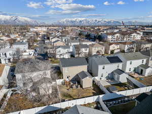 Birds eye view of property with a residential view and a mountain view