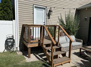 Deck with an outdoor hangout area and a patio area