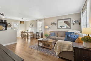 Living area featuring wood finished floors and baseboards