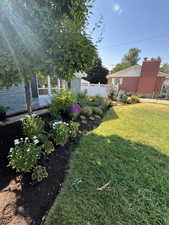 View of yard featuring fence