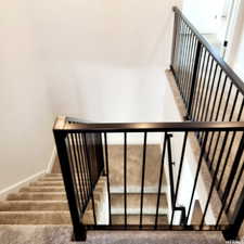 Stairway featuring baseboards and carpet flooring