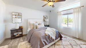 Bedroom with a ceiling fan, a textured ceiling, baseboards, and carpet flooring