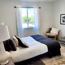 Bedroom with carpet and baseboards