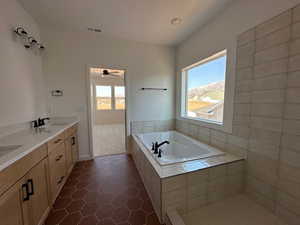 Full bath with a garden tub, tile patterned flooring, a sink, and visible vents