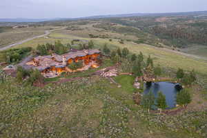 Aerial view of property and surrounding area featuring a large body of water