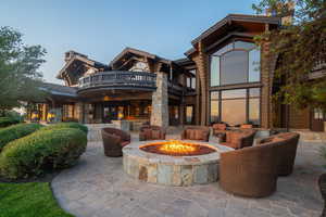 View of building exterior featuring a fire pit