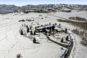 Snowy aerial view with a mountain view