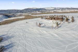 Snowy aerial view with a mountain view