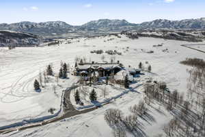Snowy aerial view with a mountain view