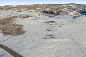 Snowy aerial view with a mountain view