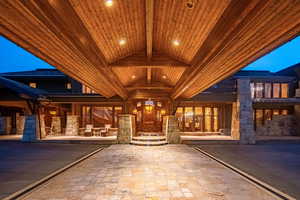 View of exterior entry featuring stone siding