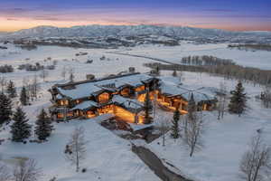 Snowy aerial view with a mountain view