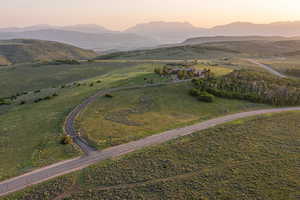 Aerial view at dusk of a mountain view and a view of countryside