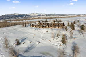Snowy aerial view with a mountain view