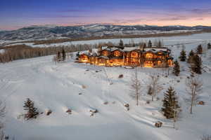 Snowy aerial view with a mountain view