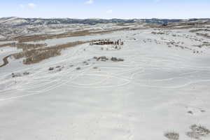 Snowy aerial view featuring a mountain view