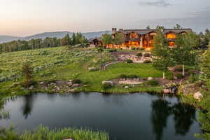 Aerial view at dusk of a water and mountain view