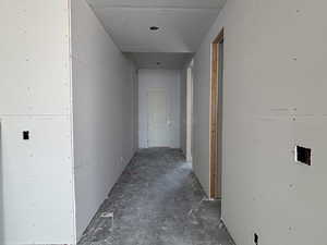 Hallway with concrete floors