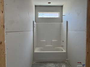 Full bath featuring a bath