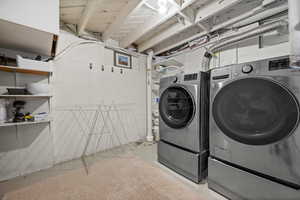 Laundry room with laundry area and washer and dryer