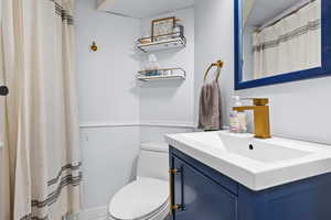 Bathroom featuring vanity and toilet