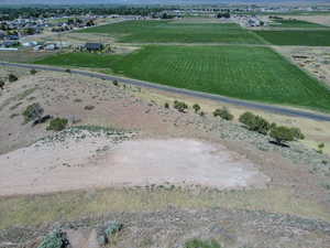 Overview of rural landscape featuring large plots for crops