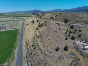 Aerial overview of property's location featuring rural landscape and mountains