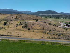 View of mountain backdrop featuring rural landscape