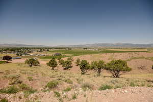 View of mountain backdrop featuring rural landscape