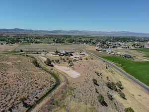 Overview of rural landscape featuring a mountain backdrop