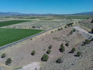 Overview of rural landscape featuring a mountainous background