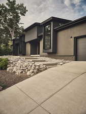 Exterior space featuring a garage and concrete driveway